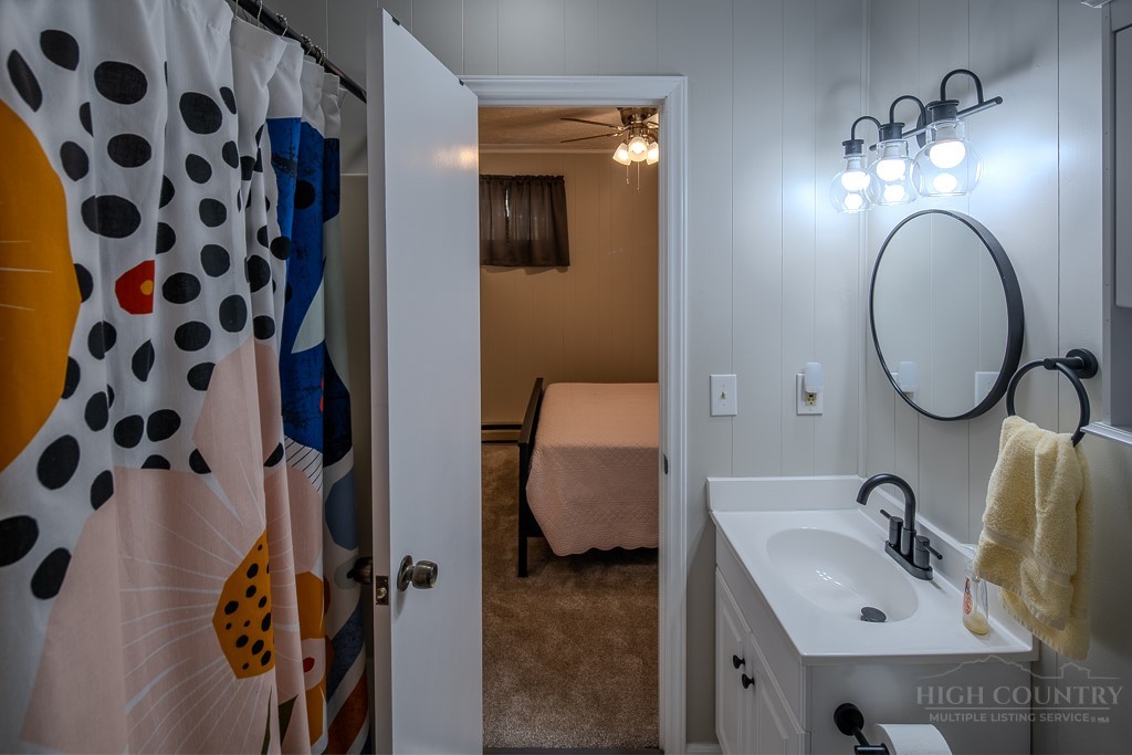 38 Rocky Meadows Road Newland, NC 28657 - Photo 29 of 50 a bathroom with a sink and a mirror