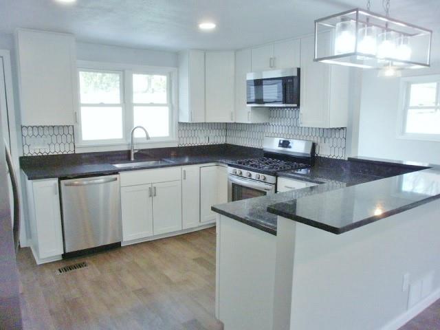 305 East McMurray Road Canonsburg, PA 15317 - Photo 6 of 24 a kitchen with granite countertop a sink a stove and cabinets