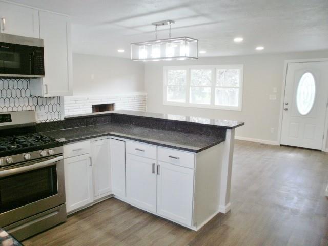 305 East McMurray Road Canonsburg, PA 15317 - Photo 9 of 24 a kitchen with granite countertop a stove a sink and a microwave