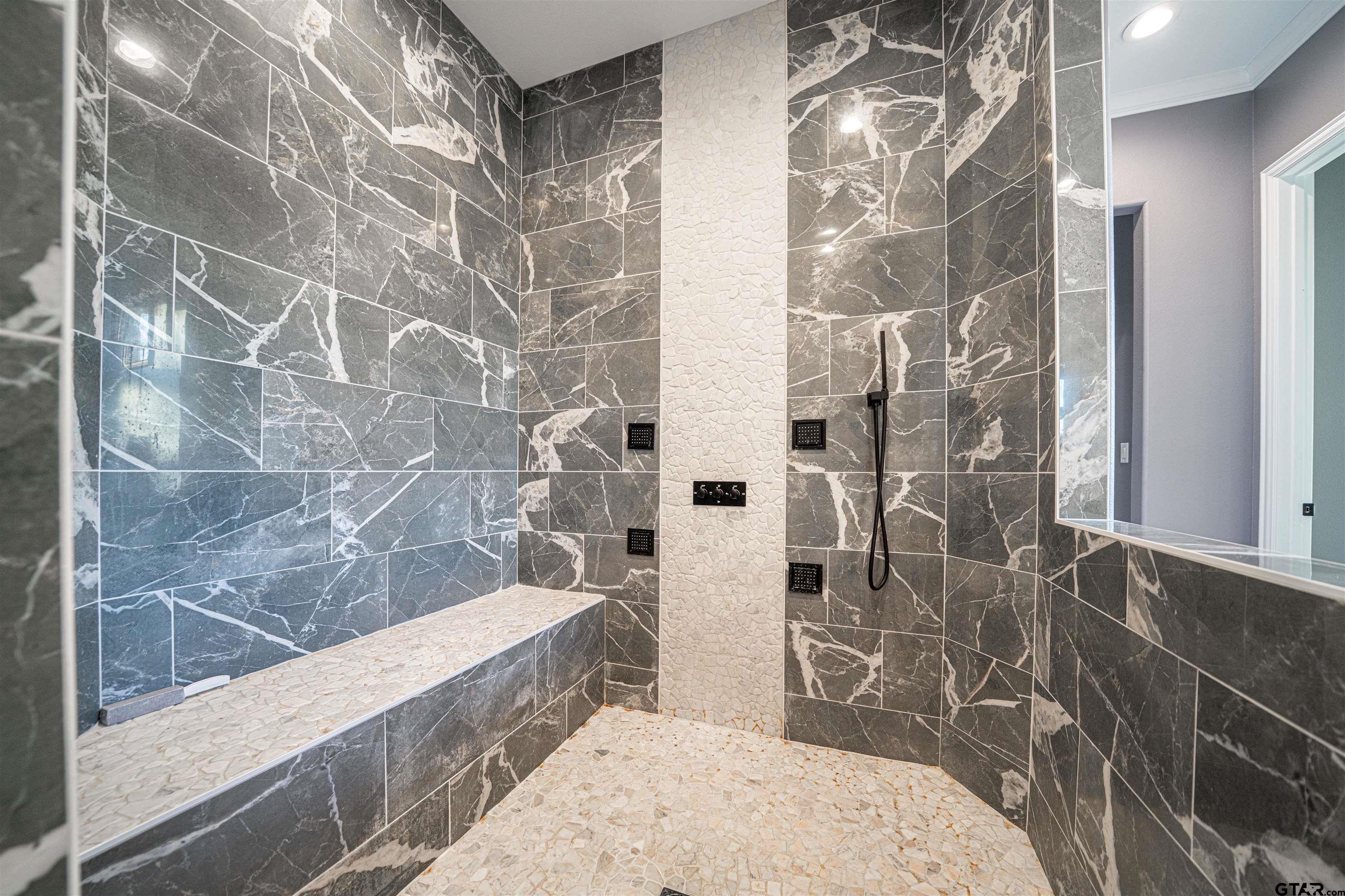 145 Private Road Pittsburg, TX 75686 - Photo 20 of 46 a bathroom with a bathtub and shower