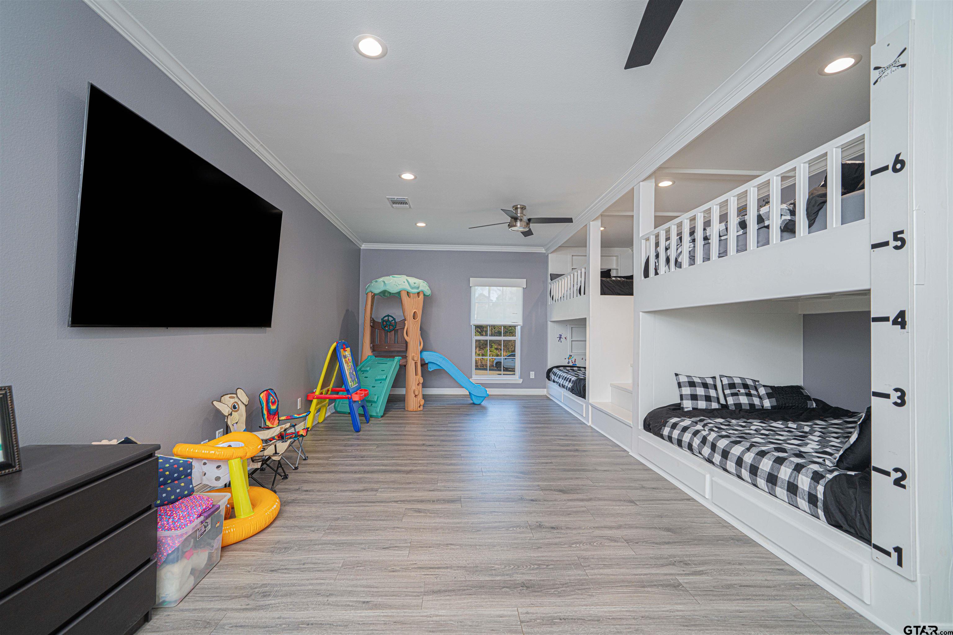 145 Private Road Pittsburg, TX 75686 - Photo 25 of 46 a living room with furniture and a flat screen tv