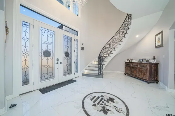 a kitchen with stainless steel appliances granite countertop white cabinets and a stove