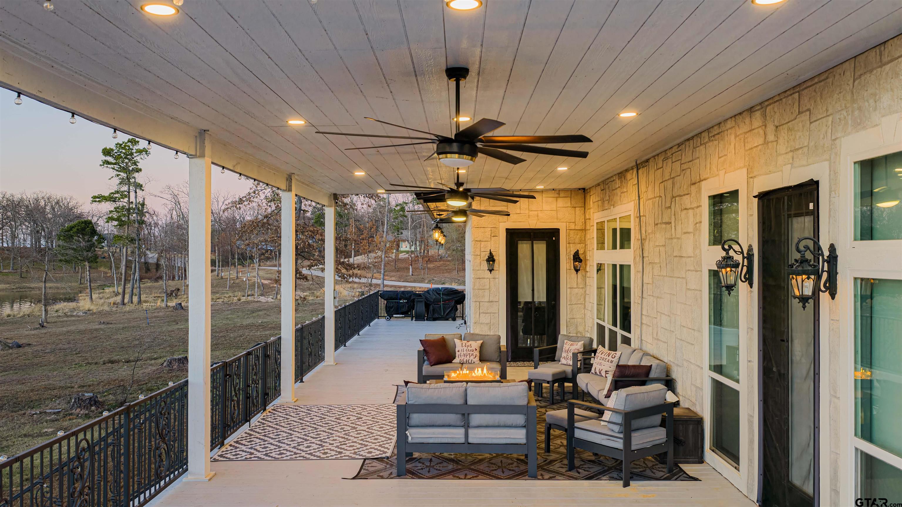 145 Private Road Pittsburg, TX 75686 - Photo 35 of 46 a outdoor living space with patio furniture and a chandelier