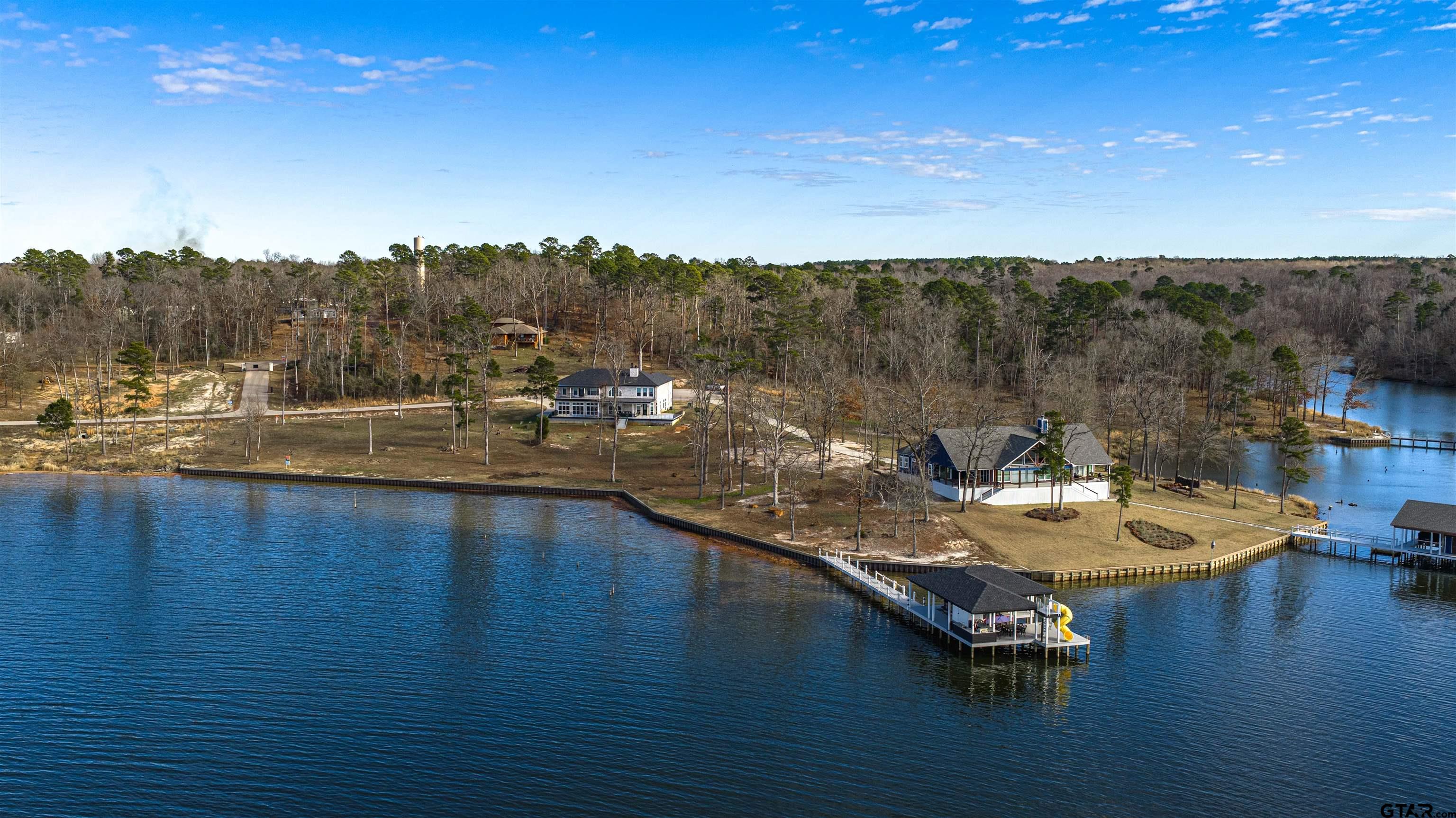 145 Private Road Pittsburg, TX 75686 - Photo 46 of 46 a view of a lake with furniture