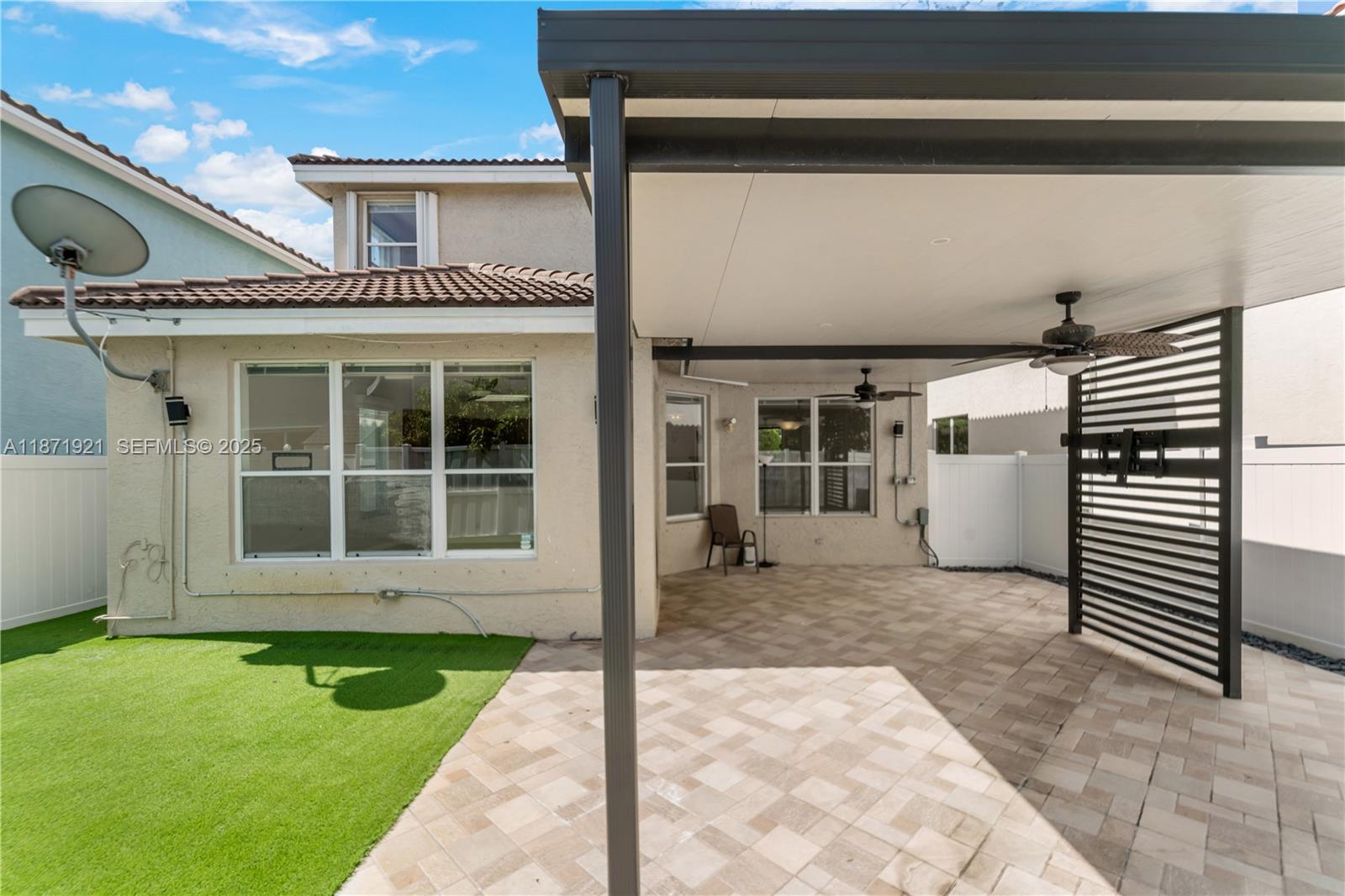 1943 Southwest 149th Avenue Miramar, FL 33027 - Photo 18 of 26 a front view of a house with a garden and yard