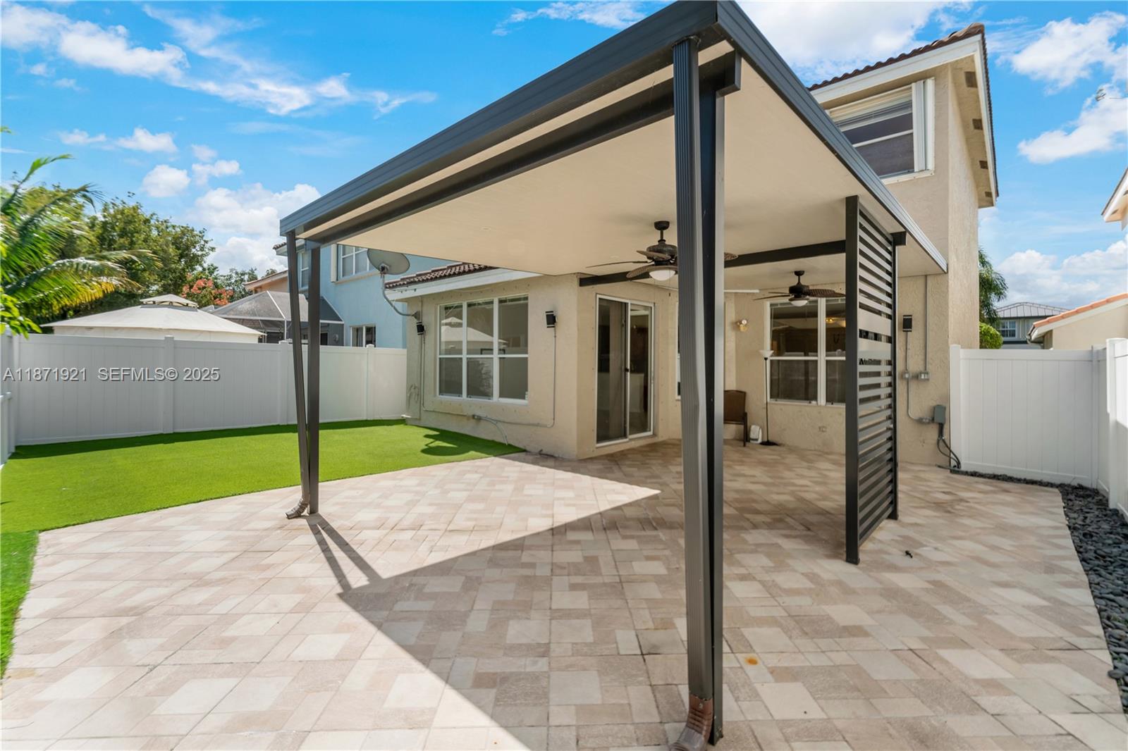 1943 Southwest 149th Avenue Miramar, FL 33027 - Photo 5 of 26 a view of a house with a backyard