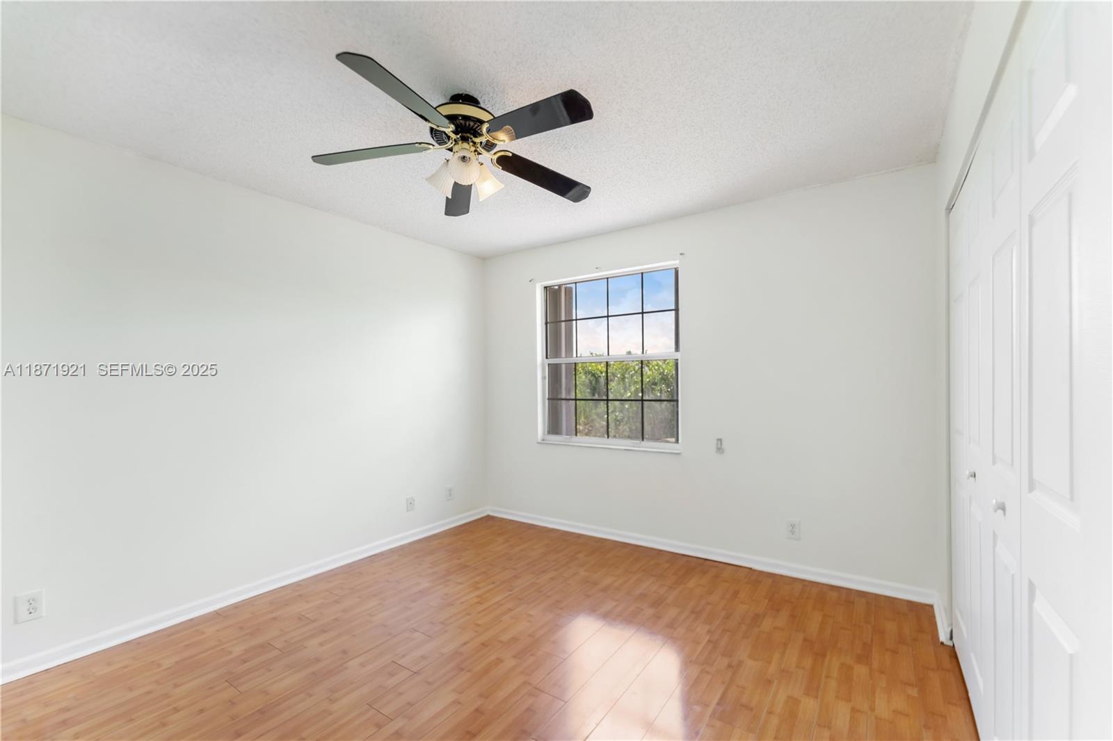 1943 Southwest 149th Avenue Miramar, FL 33027 - Photo 9 of 26 a view of a big room with wooden floor and windows