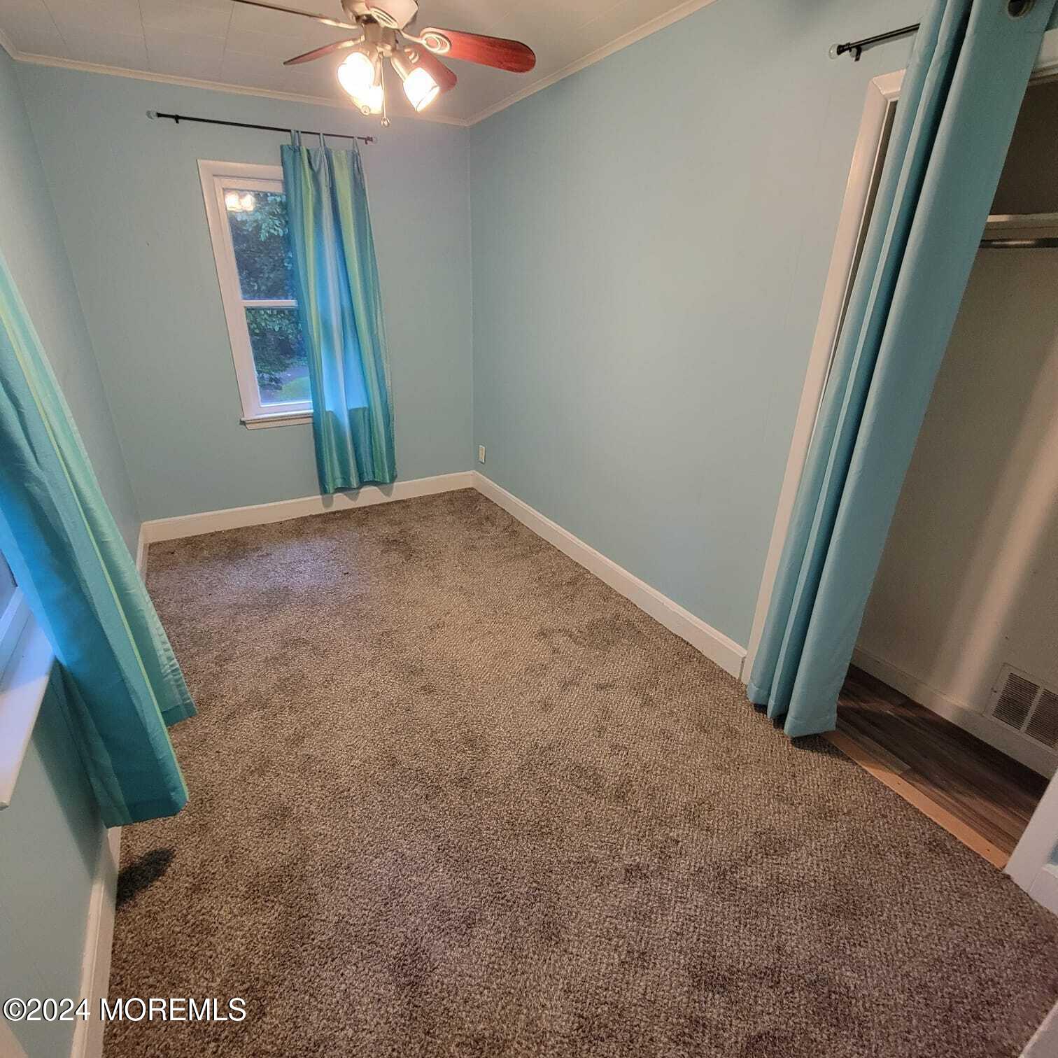63 Reids Hill Road Morganville, NJ 07751 - Photo 19 of 32 a view of a livingroom with a staircase