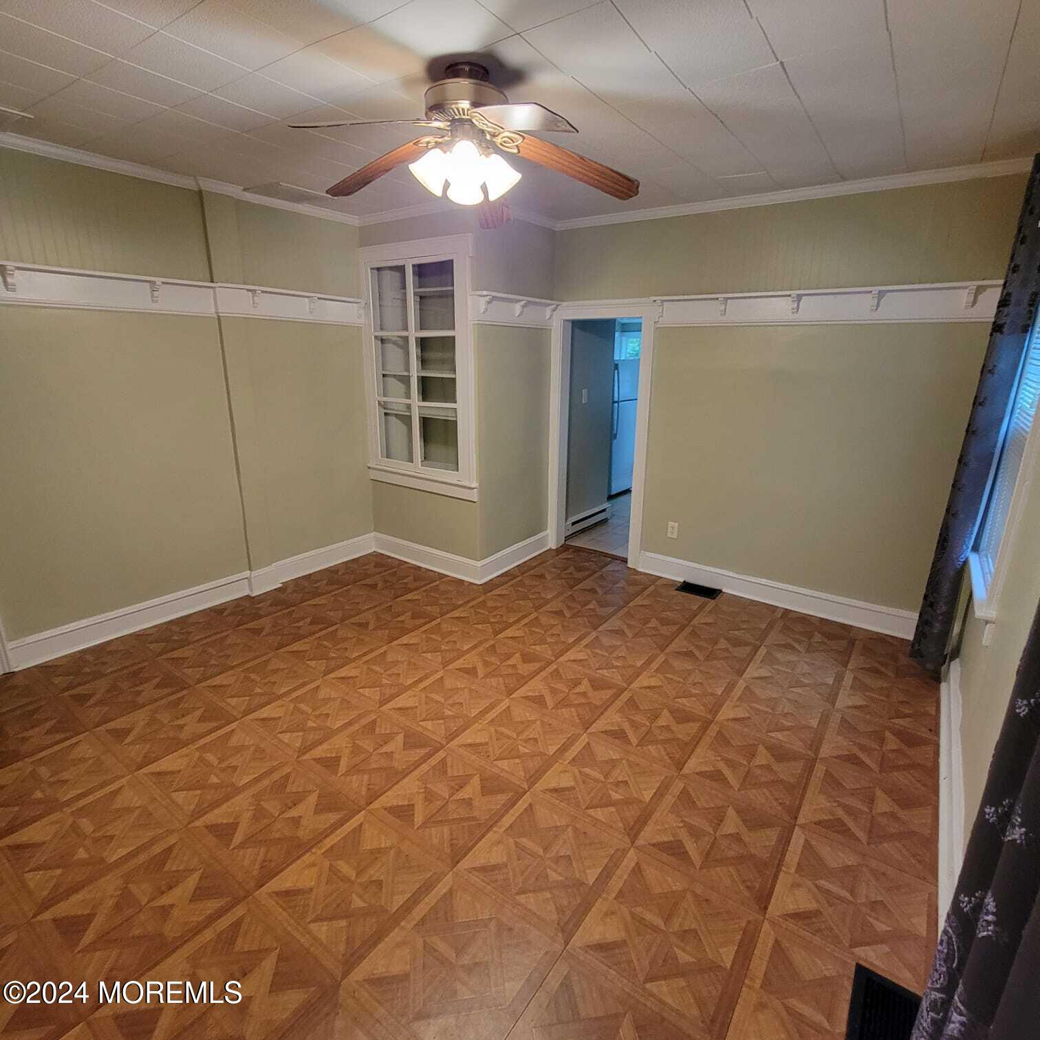 63 Reids Hill Road Morganville, NJ 07751 - Photo 7 of 32 a view of an empty room with a window