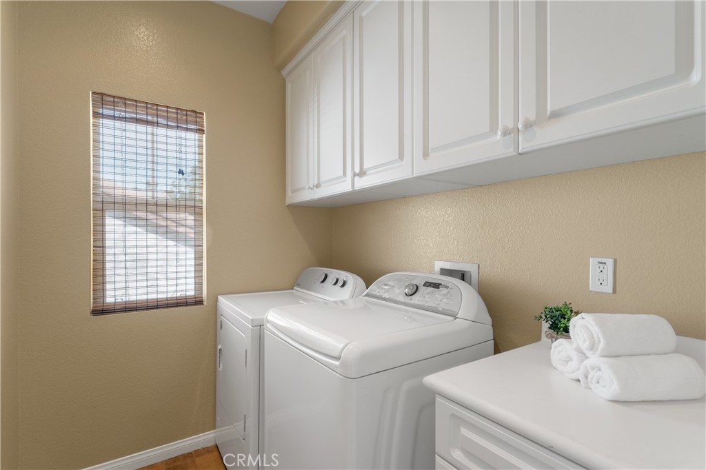28817 Edenton Way Temecula, CA 92591 - Photo 40 of 56 a utility room with dryer and washer
