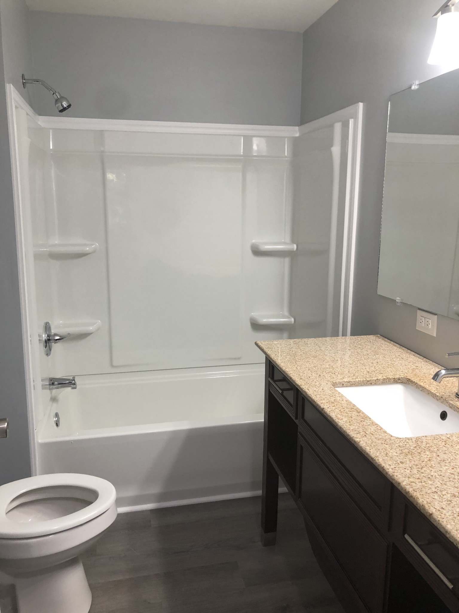 421 Oakwood Road Tullahoma, TN 37388 - Photo 11 of 13 a bathroom with a granite countertop sink toilet and shower