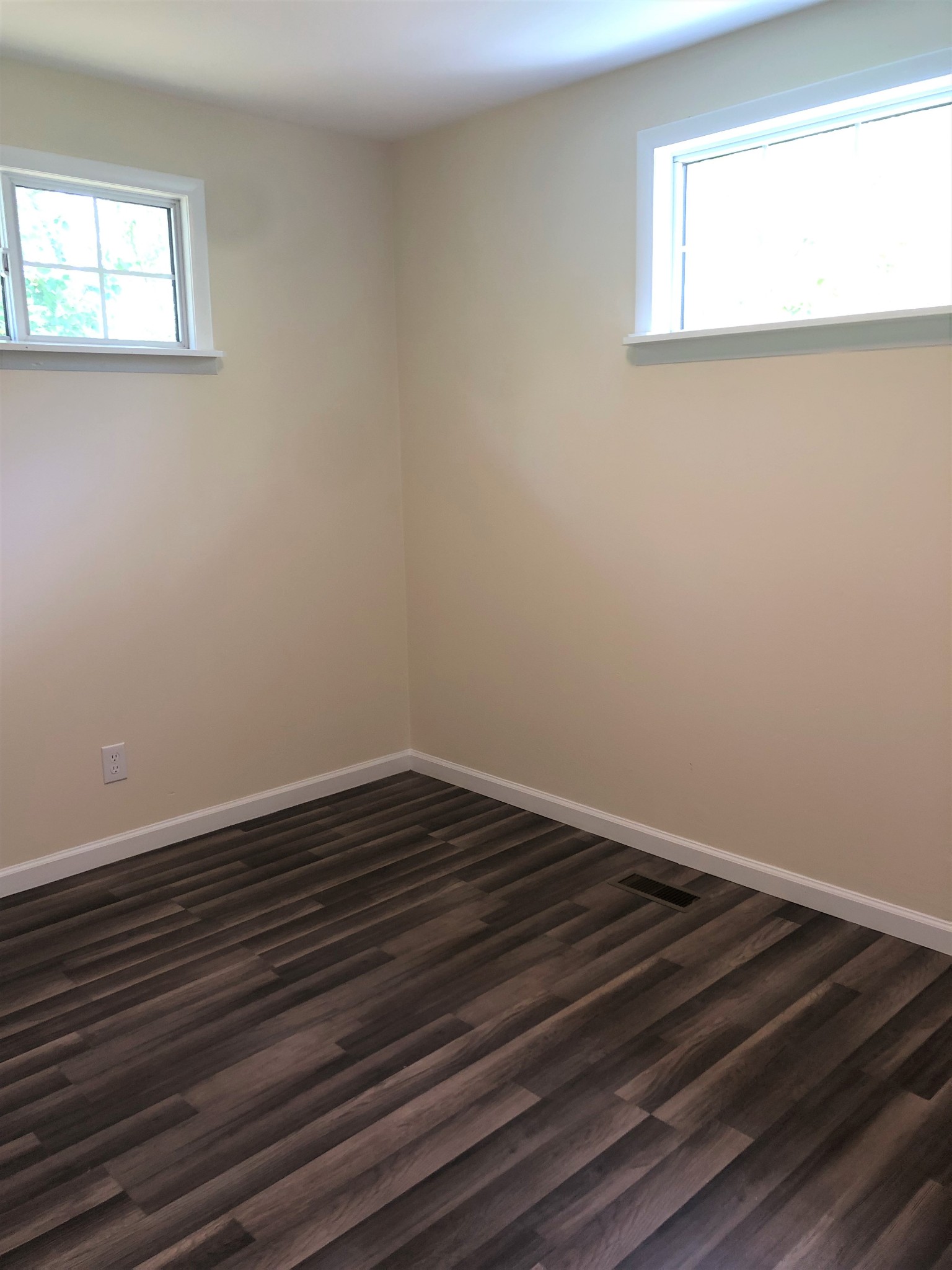 421 Oakwood Road Tullahoma, TN 37388 - Photo 12 of 13 a view of an empty room with wooden floor and a window