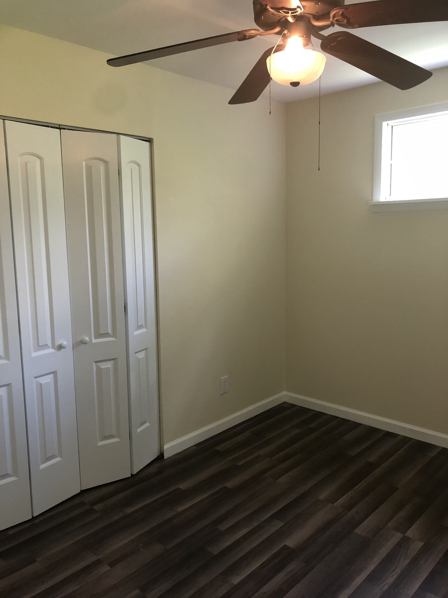 421 Oakwood Road Tullahoma, TN 37388 - Photo 13 of 13 a view of a small space with wooden floor and fan