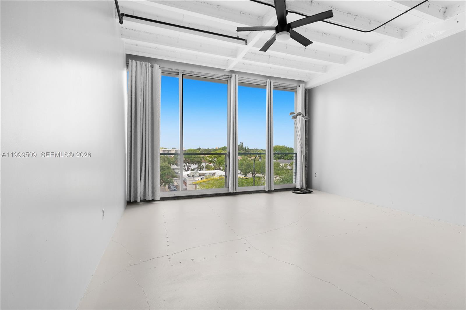 8101 Biscayne Boulevard, Unit R414 Miami, FL 33138 - Photo 8 of 27 a view of an empty room with a window