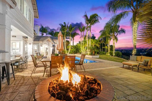 a view of a patio with swimming pool