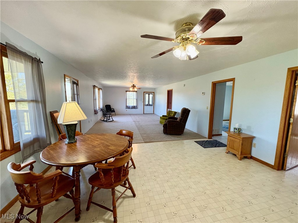 3333 Force Road Shreve, OH 44676 - Photo 13 of 26 Dining area featuring ceiling fan and a textured ceiling