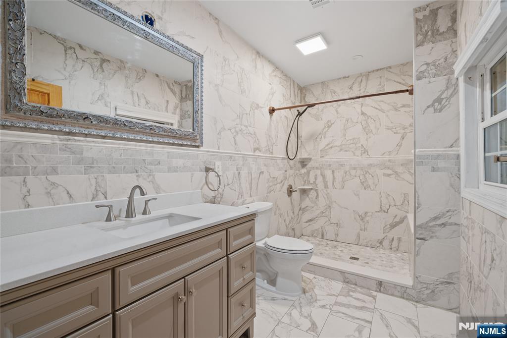 81 Fairmount Avenue Hackensack, NJ 07601 - Photo 13 of 19 a bathroom with a sink a toilet and shower