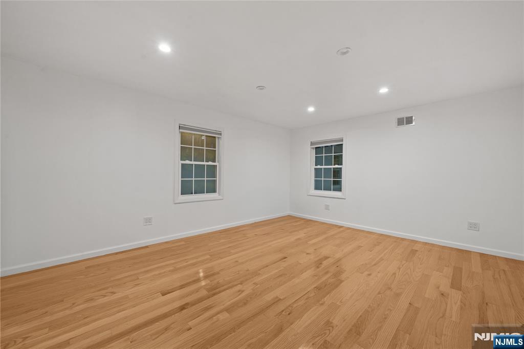 81 Fairmount Avenue Hackensack, NJ 07601 - Photo 19 of 19 a view of empty room with wooden floor and fan