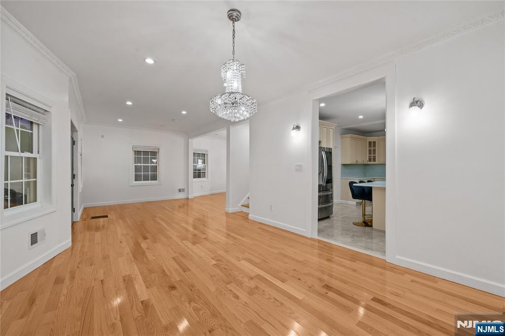 81 Fairmount Avenue Hackensack, NJ 07601 - Photo 4 of 19 a view of empty room with wooden floor and windows