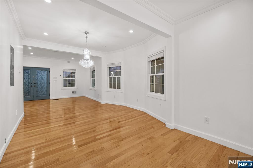 81 Fairmount Avenue Hackensack, NJ 07601 - Photo 5 of 19 a view of empty room with wooden floor and windows