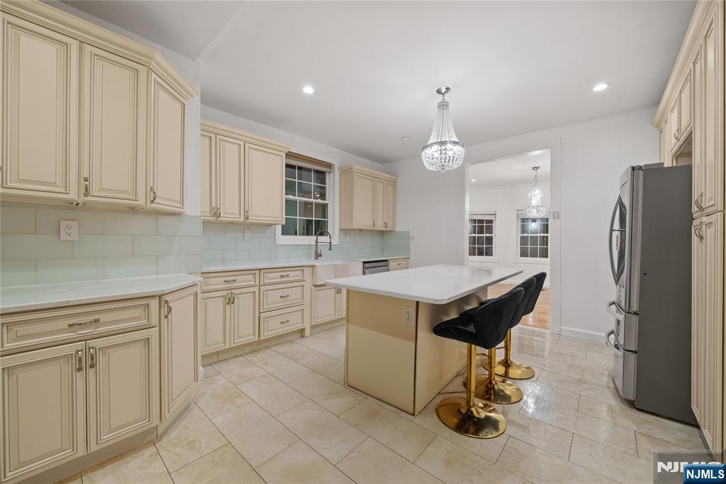 81 Fairmount Avenue Hackensack, NJ 07601 - Photo 8 of 19 a kitchen with a refrigerator a sink and cabinets