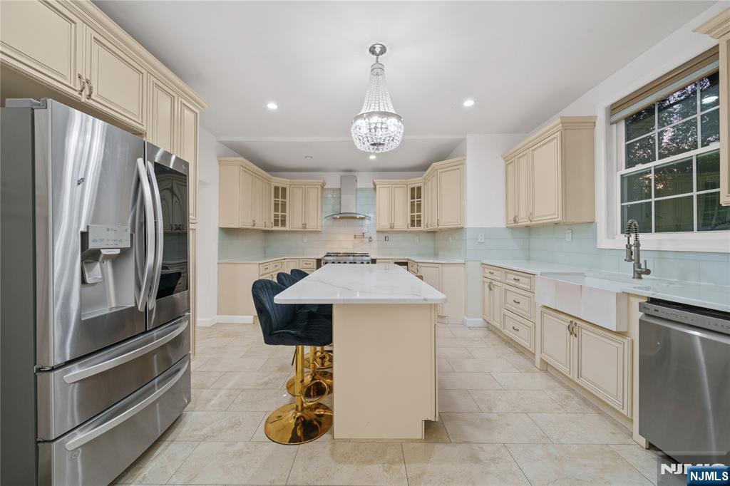 81 Fairmount Avenue Hackensack, NJ 07601 - Photo 10 of 19 a kitchen with granite countertop a sink stainless steel appliances and cabinets