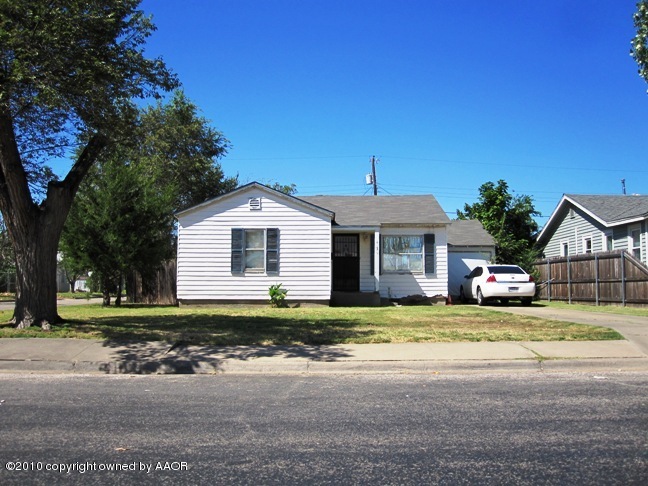 4126 South Lipscomb Street Amarillo, TX 79110 - Photo 1 of 1 a view of a house with a yard and potted plants