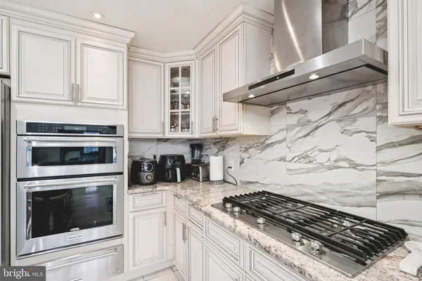 a view of an entryway with wooden floor and windows