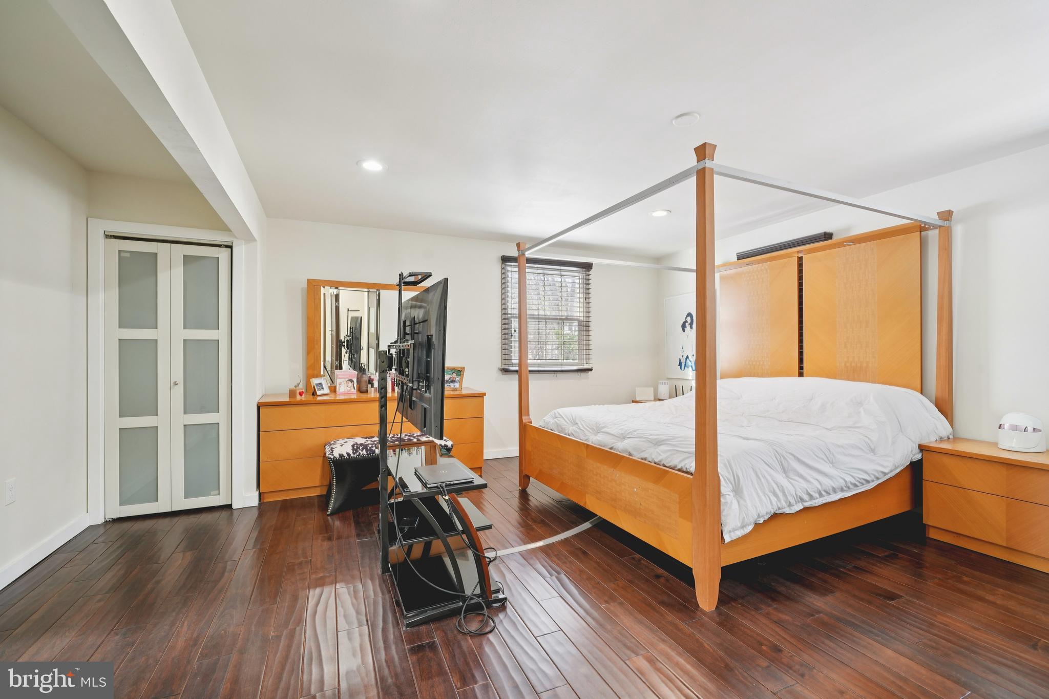700 Campwoods Road Villanova, PA 19085 - Photo 21 of 72 a bedroom with a bed and wooden floor