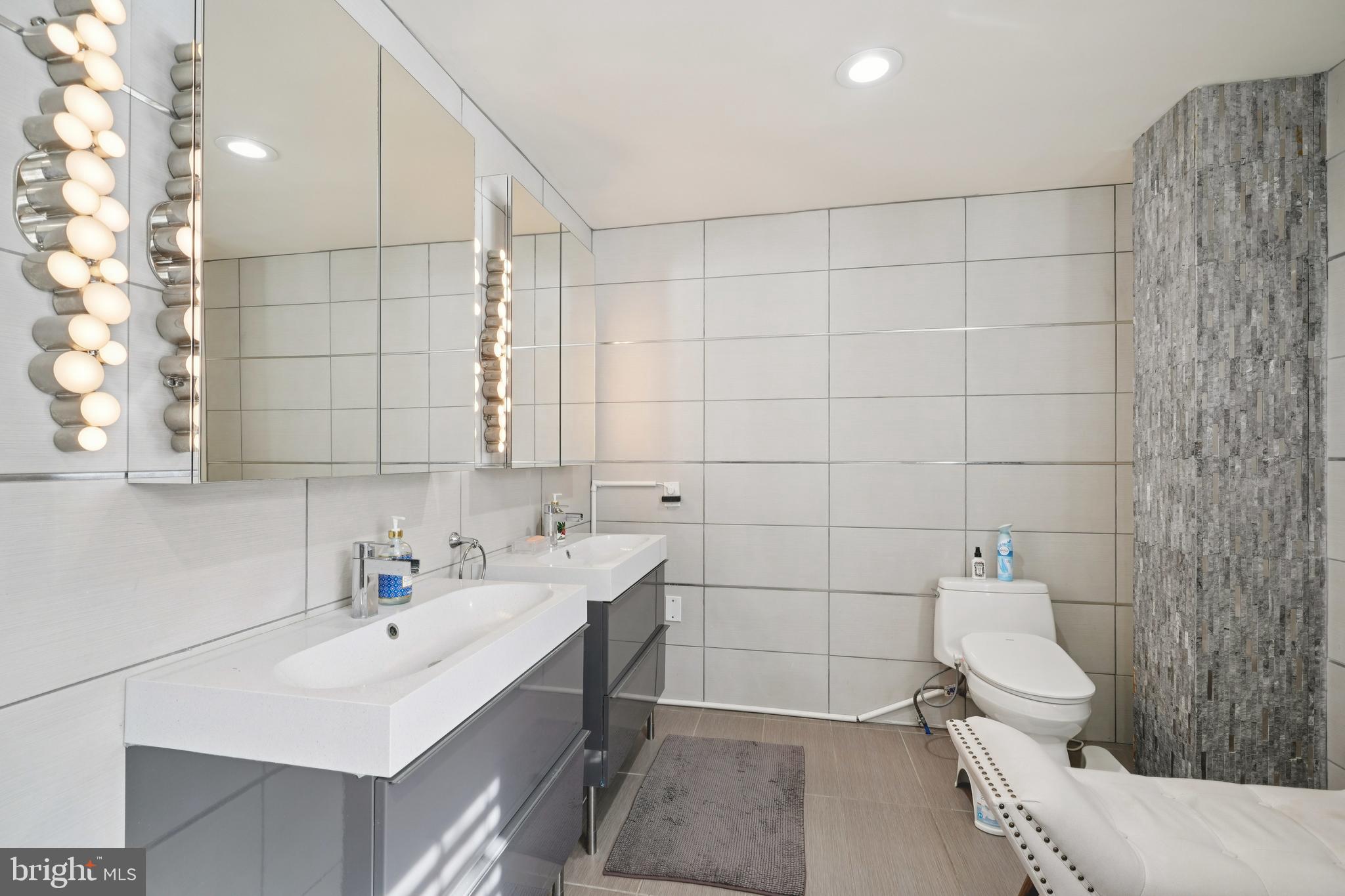 700 Campwoods Road Villanova, PA 19085 - Photo 27 of 72 a bathroom with a sink toilet and shower