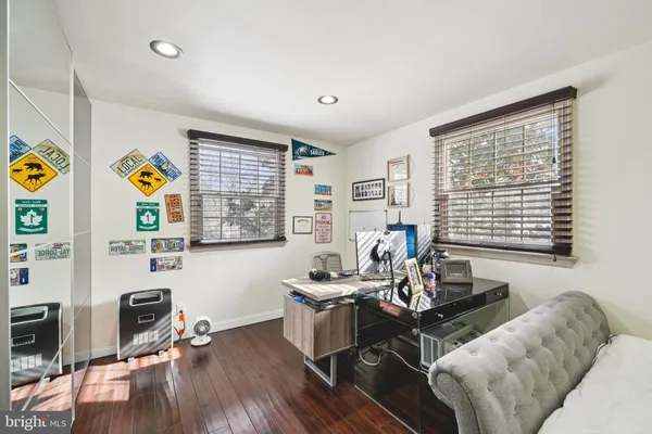 a living room with furniture gym equipment and a window