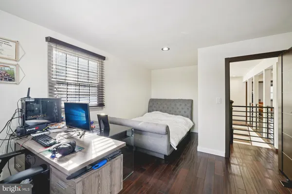 a living room with furniture rug and window