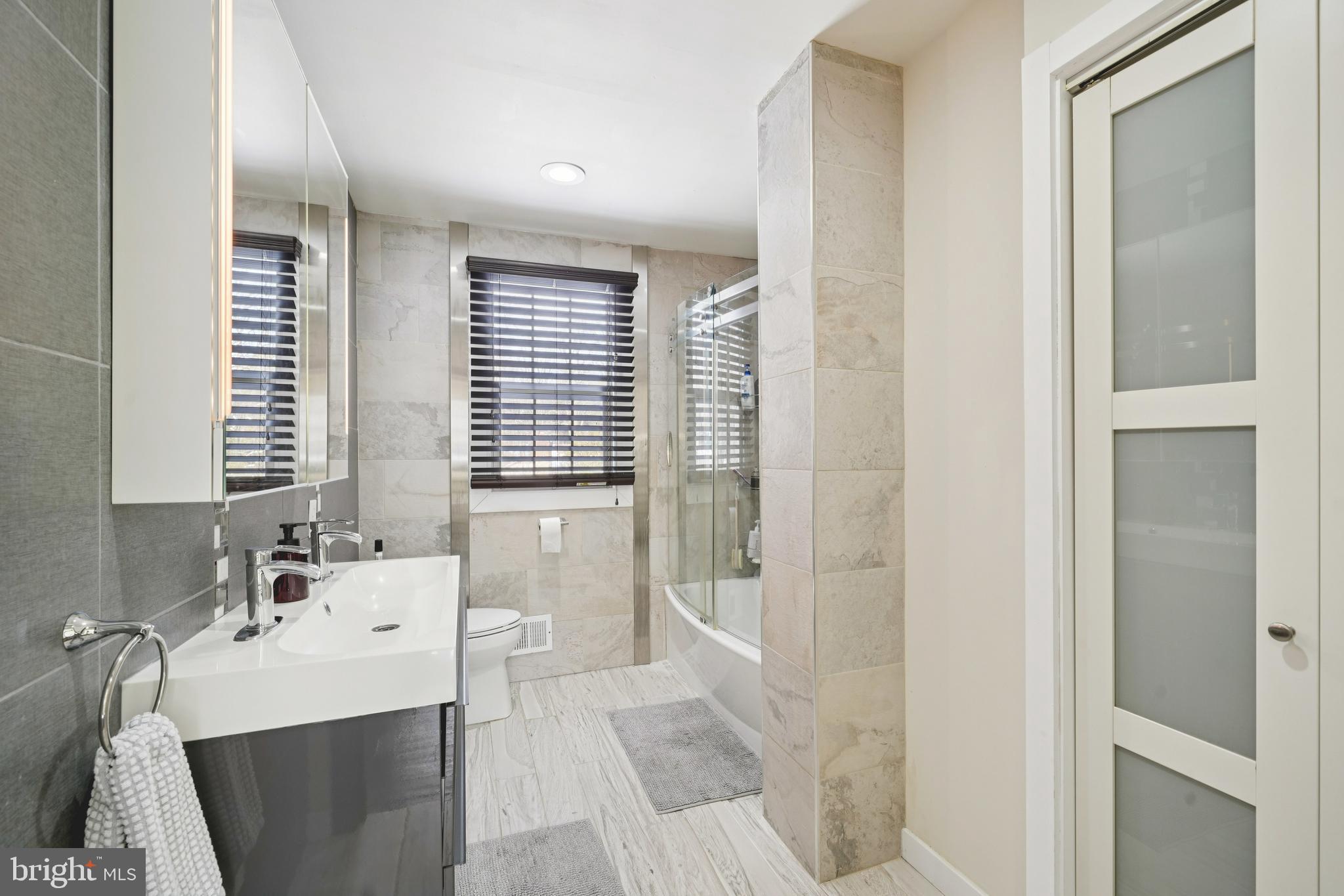 700 Campwoods Road Villanova, PA 19085 - Photo 34 of 72 a bathroom with a sink and a mirror