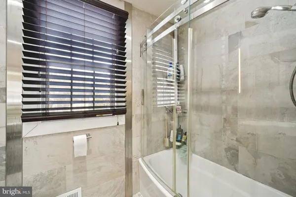 a room with a toilet and a view of bathroom