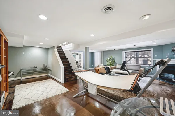 a dining room with furniture wooden floor and a potted plant