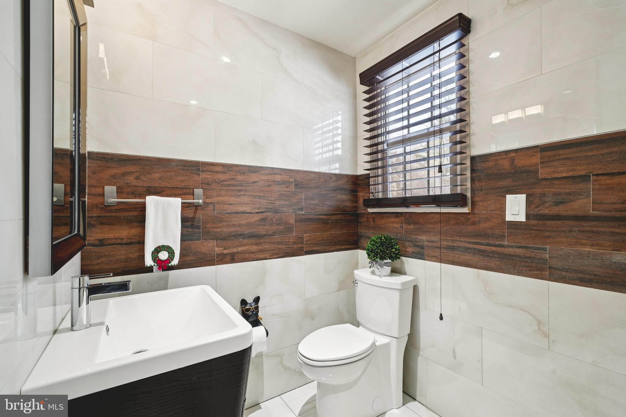 700 Campwoods Road Villanova, PA 19085 - Photo 46 of 72 a bathroom with a sink a toilet and mirror