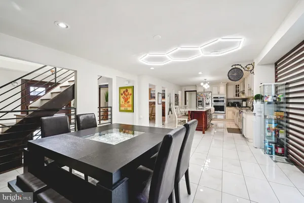 a kitchen with stainless steel appliances kitchen island granite countertop a sink and cabinets