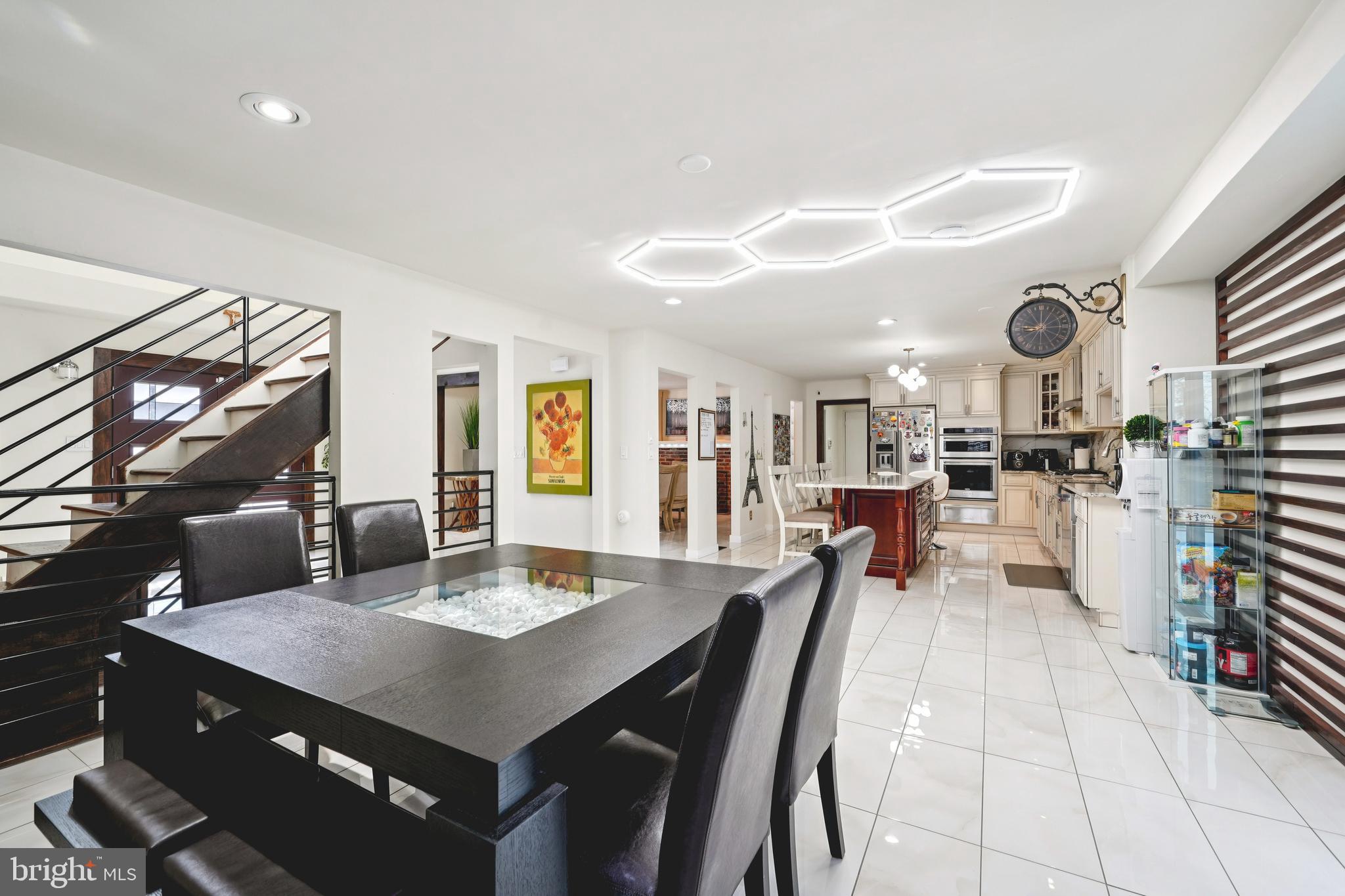 700 Campwoods Road Villanova, PA 19085 - Photo 6 of 72 a living room with stainless steel appliances furniture a rug and a kitchen view