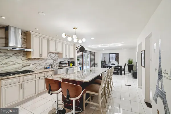 a kitchen with a dining table and chairs