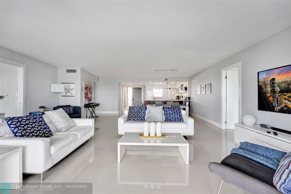 1523 East Hillsboro Boulevard, Unit 1031 Deerfield Beach, FL 33441 - Photo 17 of 78 a living room with furniture and a flat screen tv