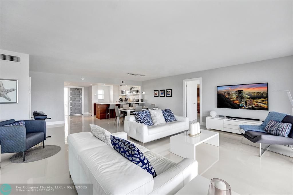 1523 East Hillsboro Boulevard, Unit 1031 Deerfield Beach, FL 33441 - Photo 20 of 78 a living room with furniture and a flat screen tv
