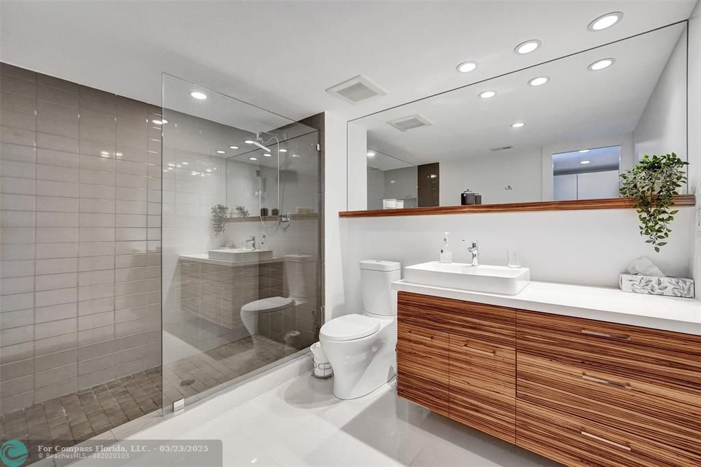 1523 East Hillsboro Boulevard, Unit 1031 Deerfield Beach, FL 33441 - Photo 36 of 78 Spa like primary bathroom