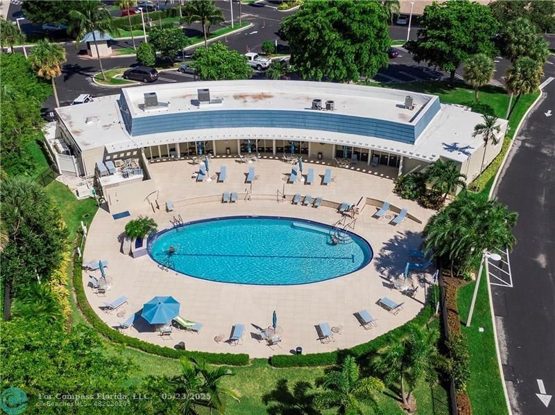1523 East Hillsboro Boulevard, Unit 1031 Deerfield Beach, FL 33441 - Photo 65 of 78 an aerial view of a house with outdoor space and garden