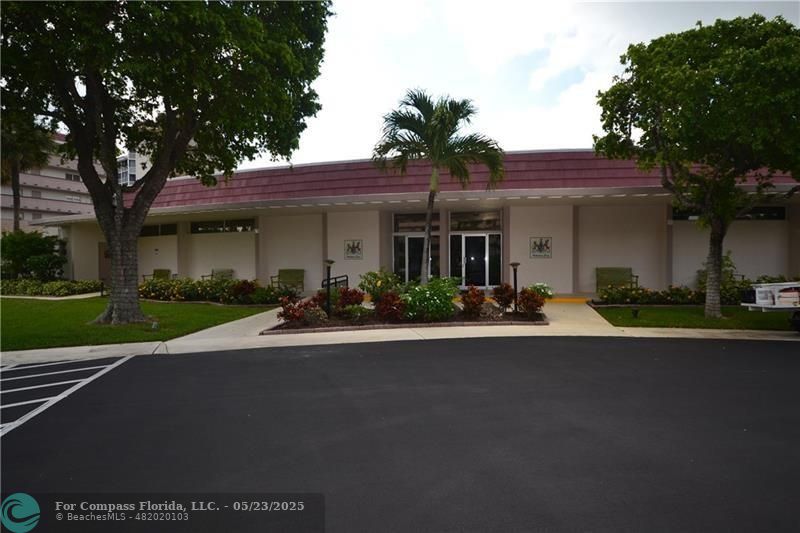1523 East Hillsboro Boulevard, Unit 1031 Deerfield Beach, FL 33441 - Photo 68 of 78 a view of a house with a yard