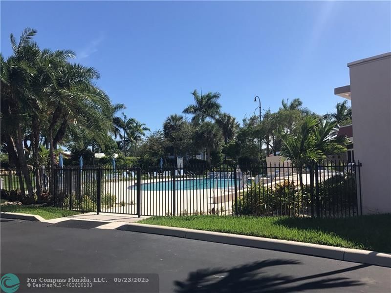 1523 East Hillsboro Boulevard, Unit 1031 Deerfield Beach, FL 33441 - Photo 69 of 78 a view of a yard with a street