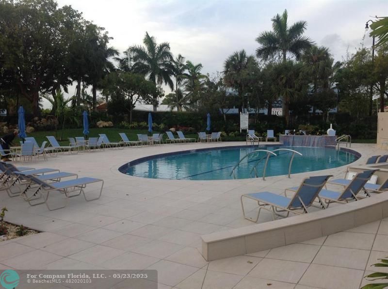 1523 East Hillsboro Boulevard, Unit 1031 Deerfield Beach, FL 33441 - Photo 70 of 78 a view of a swimming pool with a patio