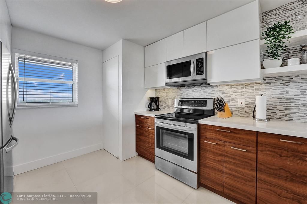 1523 East Hillsboro Boulevard, Unit 1031 Deerfield Beach, FL 33441 - Photo 7 of 78 washer dryer in that far closet