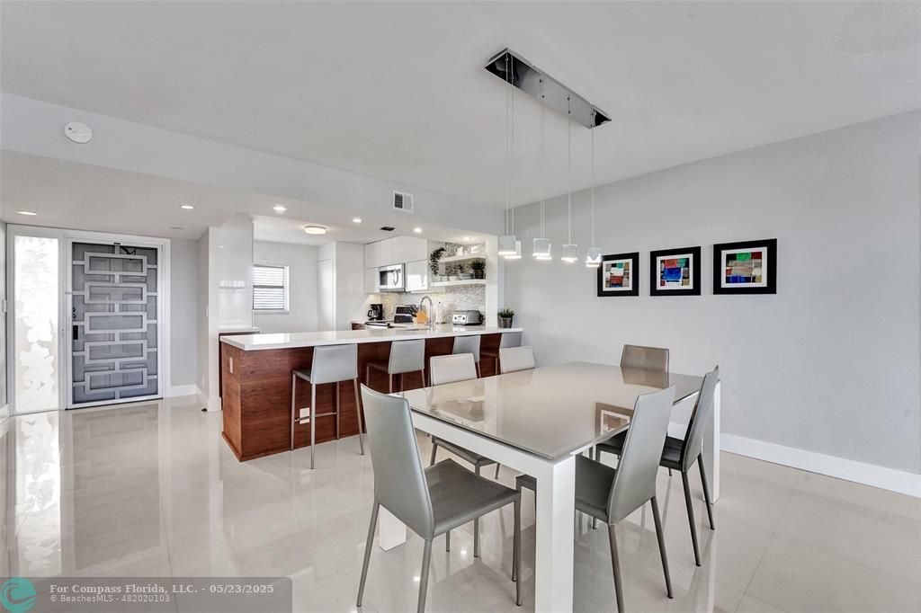 1523 East Hillsboro Boulevard, Unit 1031 Deerfield Beach, FL 33441 - Photo 10 of 78 a view of a dining room with furniture