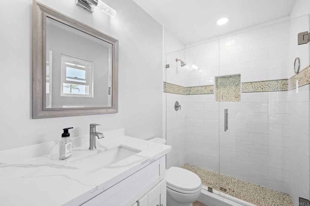 528 E Avenue Coronado, CA 92118 - Photo 11 of 19 a bathroom with a sink a toilet and shower