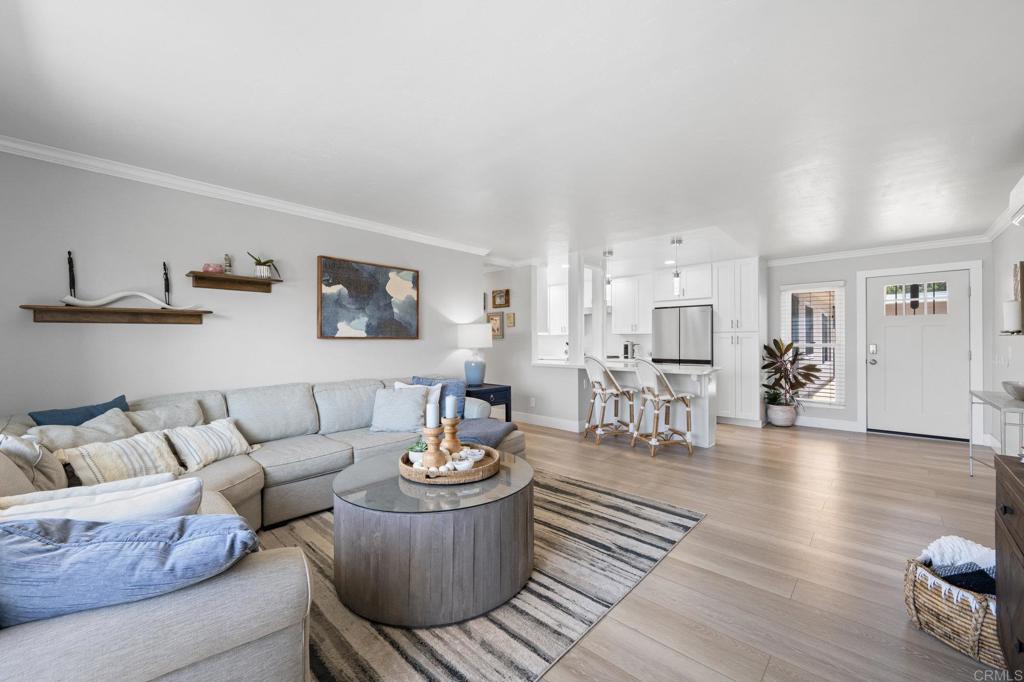 528 E Avenue Coronado, CA 92118 - Photo 4 of 19 a living room with furniture and wooden floor